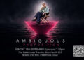 Hilary Cordery as Margaret Woods seated above a glowing magenta platform in Ambiguous Proposition