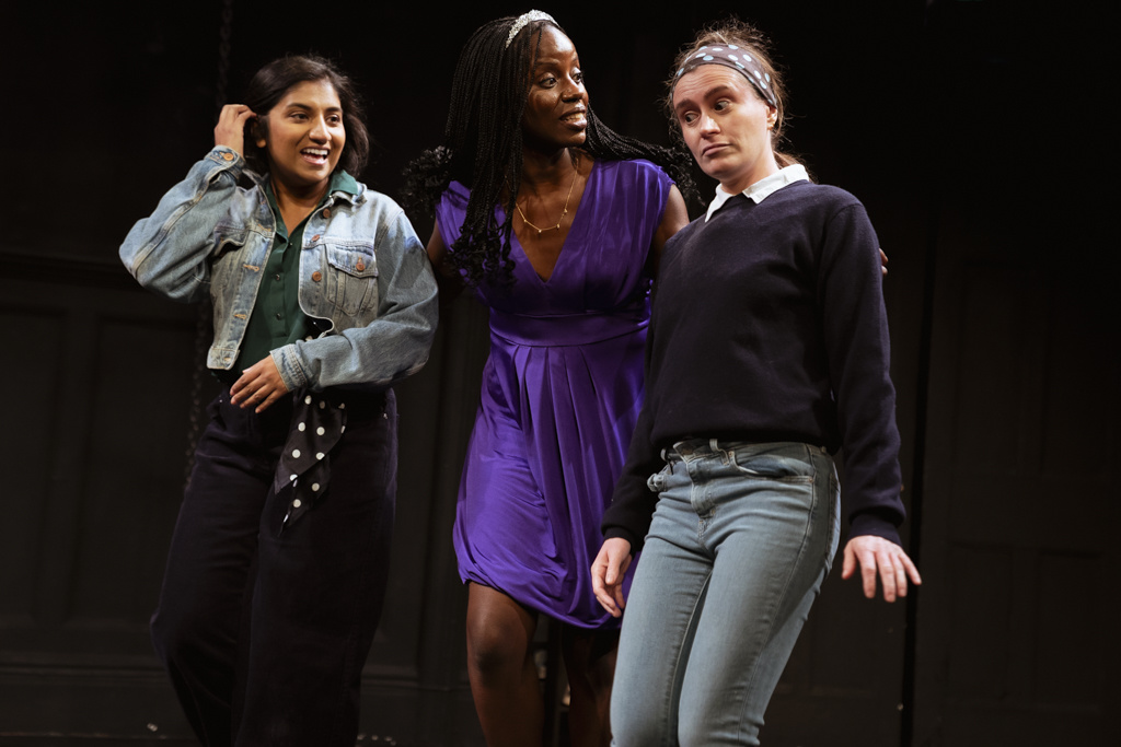 Three performers from Jester Collective’s production of Hamlet at Theatro Technis, standing together on stage.