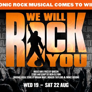 We Will Rock You promotional poster for Theatre Royal Windsor, with the musical’s orange logo above a cheering crowd